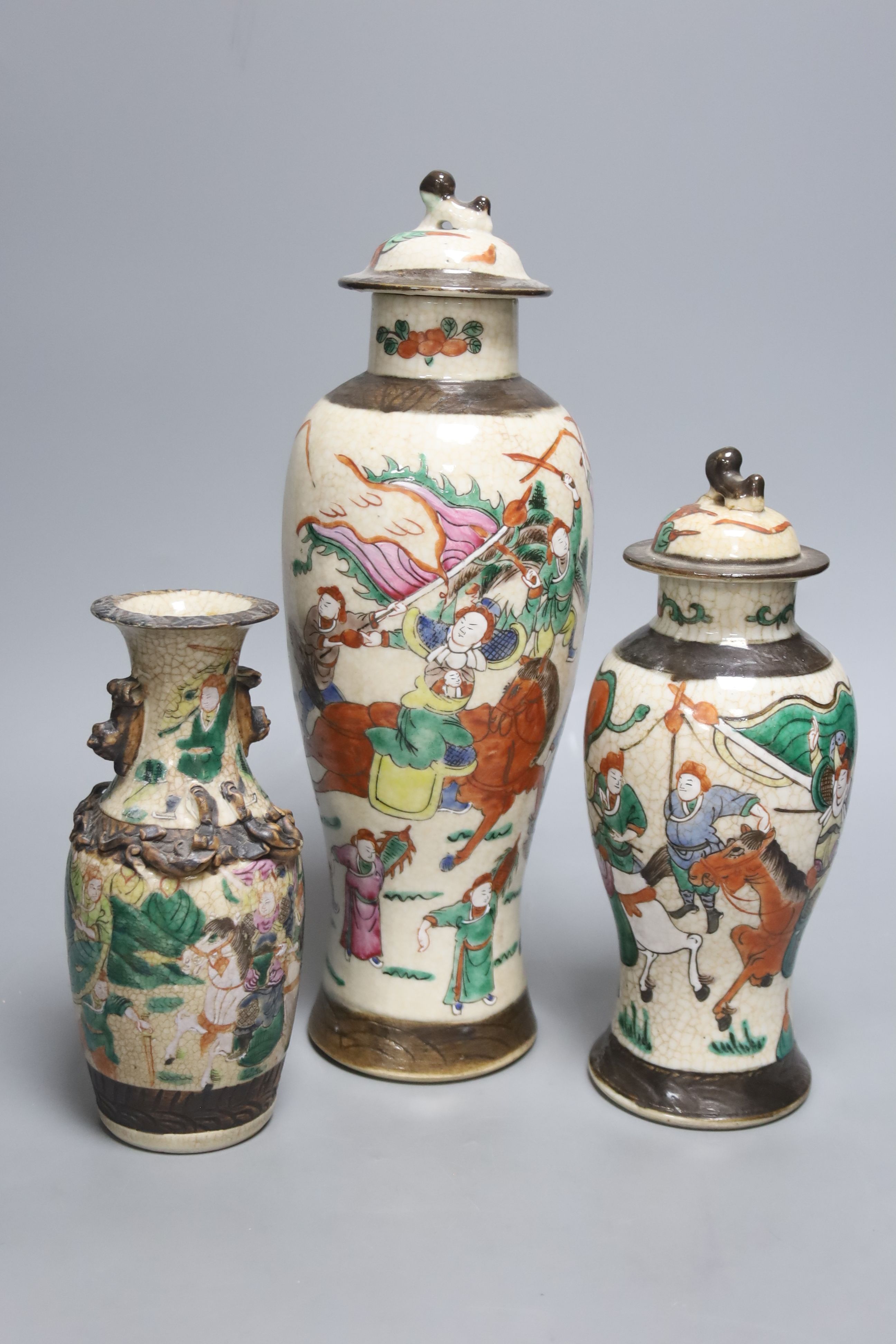 Three early 20th century Chinese crackle glaze vases, two with covers, tallest 33.5cm